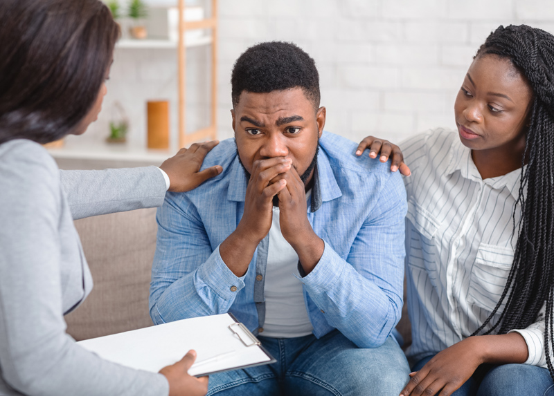 man and wife discussing the effects of marijuana with a counselor